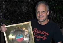 Bassist Mark Evans Auctions AC/DC Gold Record For Sydney Soccer Team
