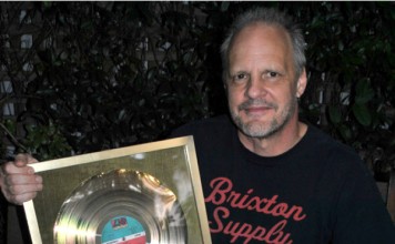 Bassist Mark Evans Auctions AC/DC Gold Record For Sydney Soccer Team